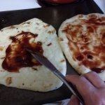 BBQ sauce on pizza rounds