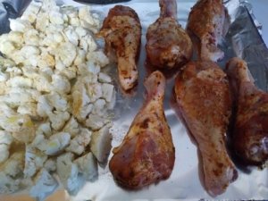 Seasoned chicken legs and cauliflower