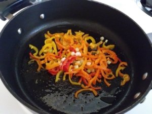 Saute peppers and onions