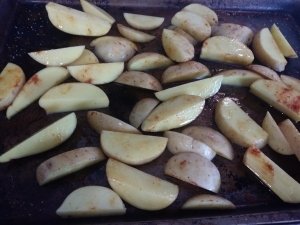 Potatoes tossed with olive oil and paprika